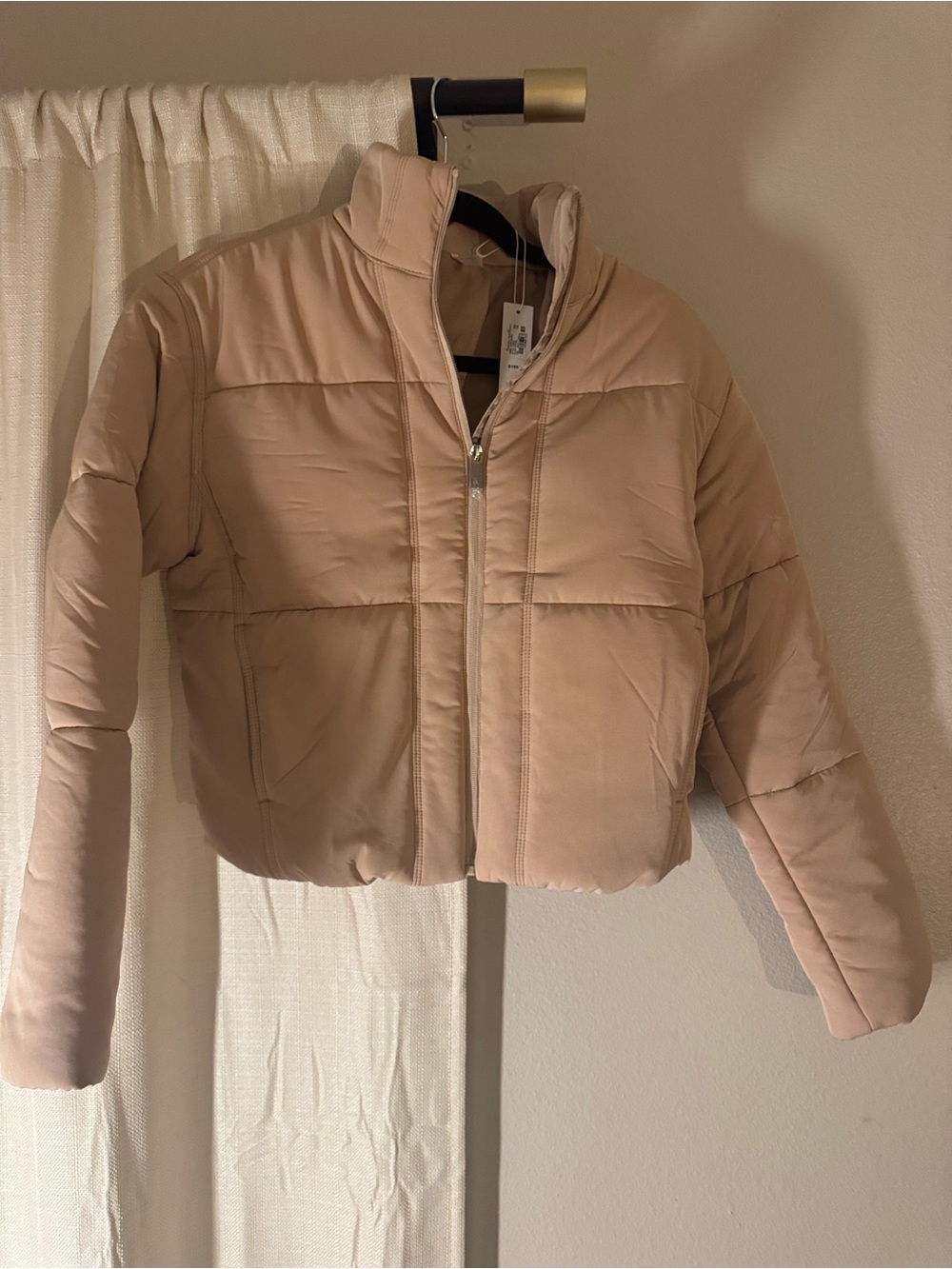 Travis Mathew Cropped Puffer Jacket in Light Beige